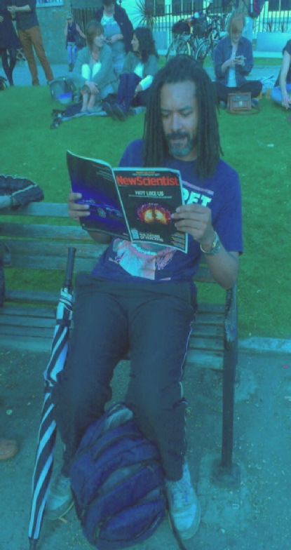 picture of Keep it casual young reader in T-shirt and track suit with New Scientist issue